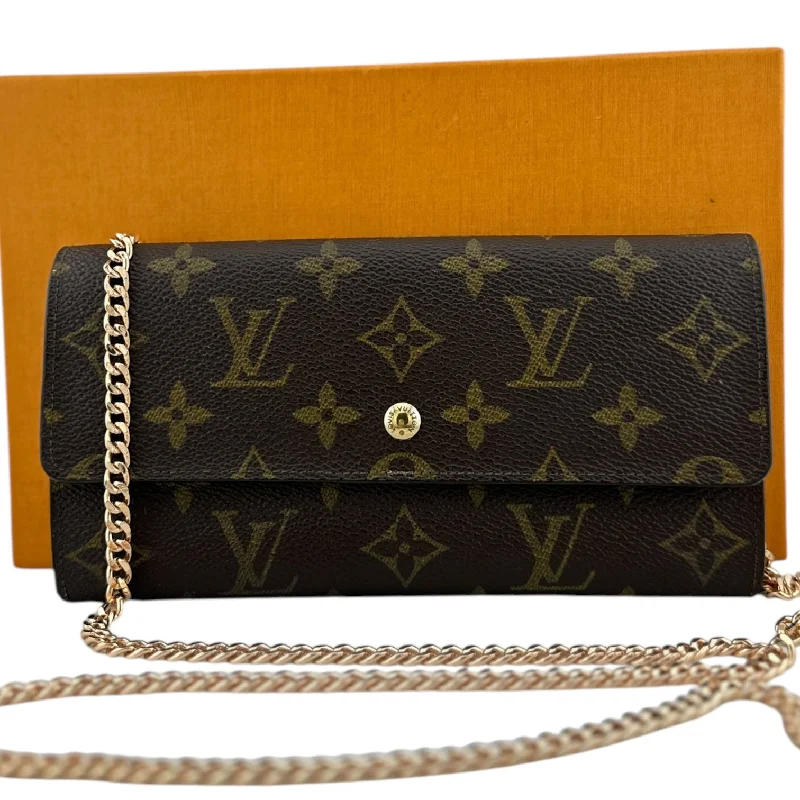 Louis Vuitton crossbody bags with a woven leather strap for textureLOUIS VUITTON Monogram Coated Canvas Sarah Wallet with added Chain