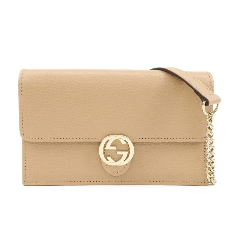 Ladies Gucci shoulder bags with a tassel decorationGUCCI Interlocking G Leather Chain Shoulder Wallet Beige 615523