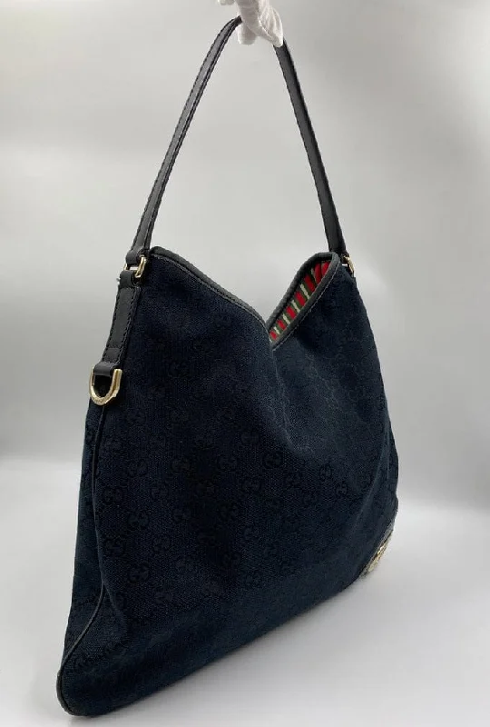 Women Gucci Sylvie bags with a leather - wrapped handleGucci Vintage Canvas Hobo Tote