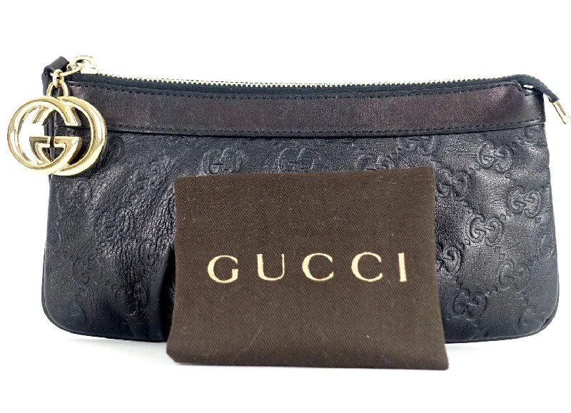 Women Gucci bags with a snap - button closure and a decorative charmSukey Monogram Leather GG Charm Wristlet Bag