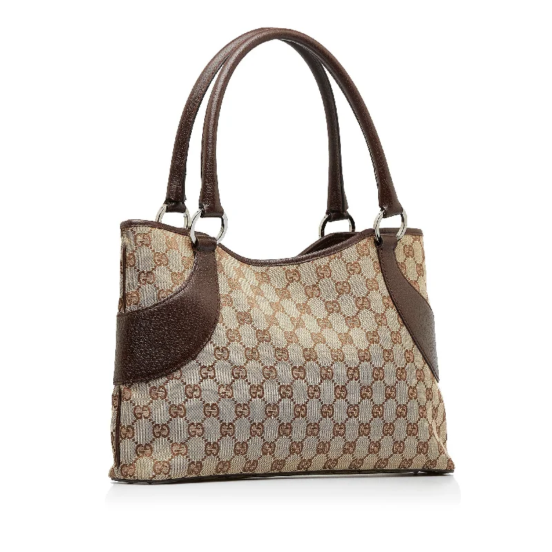 Women Gucci bags with a zip - around closure for securityGUCCI GG Canvas Shoulder Bag