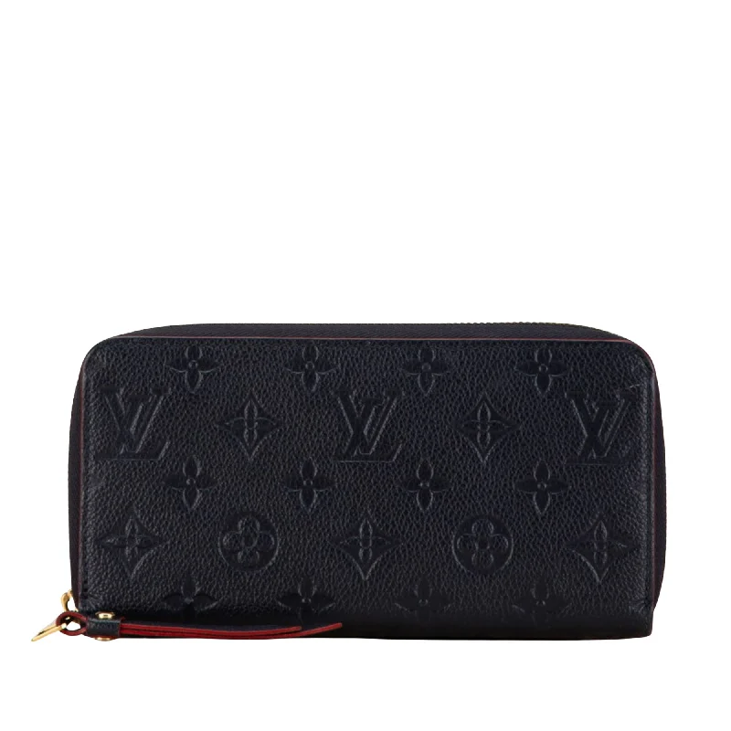 Louis Vuitton Alma bags with a monogram - embossed leather surfaceLOUIS VUITTON Zippy wallet