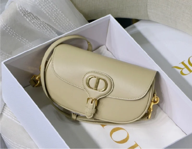 Christian Dior handbags with a snap - button closure and a decorative buckleDIOR woman crossbody handbag